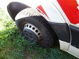 a close up of a tire on the side of a truck