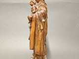 a statue of a woman holding a baby in her arms