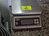 an image of a kitchen counter with a scale on it