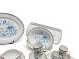 an assortment of blue and white china dishes and plates