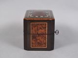 a small wooden box sitting on top of a table
