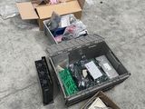 many boxes of assorted electronics on the floor