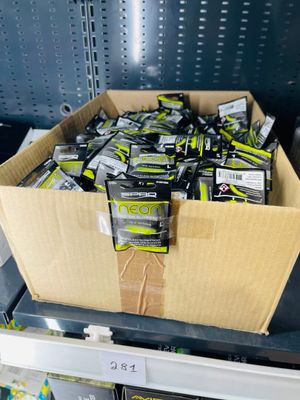 a cardboard box full of cell phones on a shelf