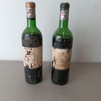 two bottles of wine sitting next to each other on a table