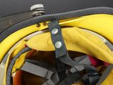 a yellow fire helmet with a black strap on it