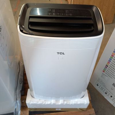 a white and black toaster sitting on a pallet
