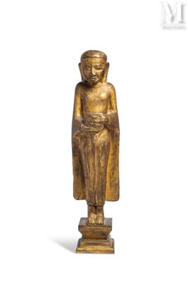 an image of a wooden statue of a person with a robe on