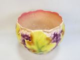 a small bowl with a flower design on it