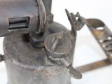 an old metal device that is sitting on a table