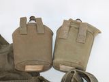 several military items are laid out on a white surface