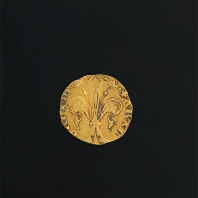 an image of a gold coin with a flower design on it