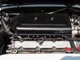 a close up view of a car engine with its hood open