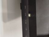 a black tablet computer sitting on top of a white table