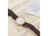 an image of a watch sitting on top of a piece of paper