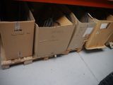 many boxes that are stacked on pallets in a store