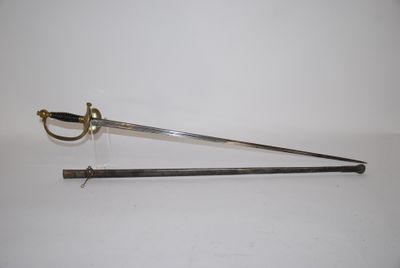 an old sword with a wooden handle on a white surface