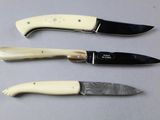 three different types of knives on the table