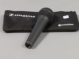 a close up of a microphone with a case on a table