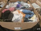 a cardboard box filled with clothes and other items