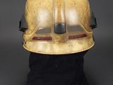 an old helmet with a black hat on top of it