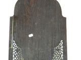 a small wooden plaque with a decorative design on it