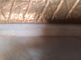 a close up of a piece of metal on a table