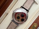 a watch that is sitting in a box on the floor