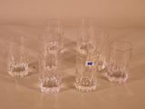 six glasses sitting on a table with a number on them