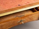 a wooden desk with a drawer underneath it