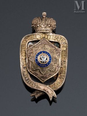 a close up of a badge with a crown on it