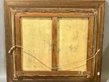 an old picture of a wooden window with a rope hanging from it ' s side