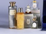 many different types of perfumes in a display case