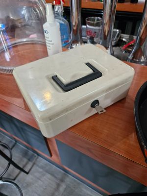 a white box sitting on top of a wooden table
