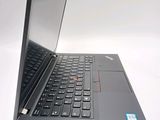 the laptop is open on a white surface with a black keyboard