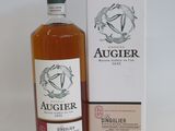 an image of a bottle of alcohol sitting next to a box