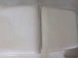 two white trays sitting on the floor next to each other