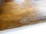 a wooden cutting board with a knife on top of it