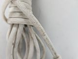 a white cord that is connected to a computer mouse
