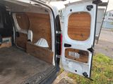 a white van with a wooden panel door open