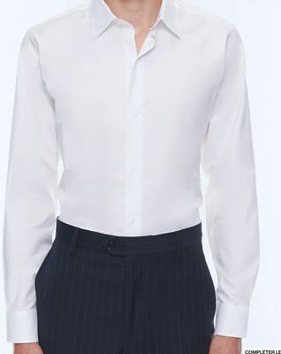 the man is wearing a white shirt and black pants