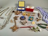 a lot of jewelry sitting on a table together