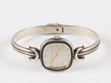 an image of a wrist watch with a silver band and a gold face