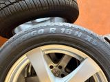 tire treads and rims of a car with a tire sticker on them
