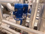 pipes and valves in a large industrial building with pipes and valves