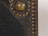 an image of a close up of a book with studs on it