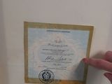 a person holding a certificate in their hand