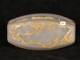 an image of a gold and white glass box