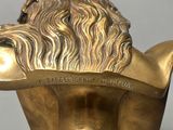 bronze statue of a man with a beard and a hat on his head