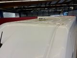 an image of a white van in a garage
