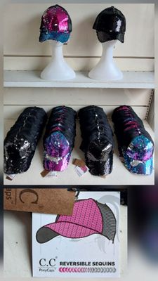 many different types of hats on display on a shelf
